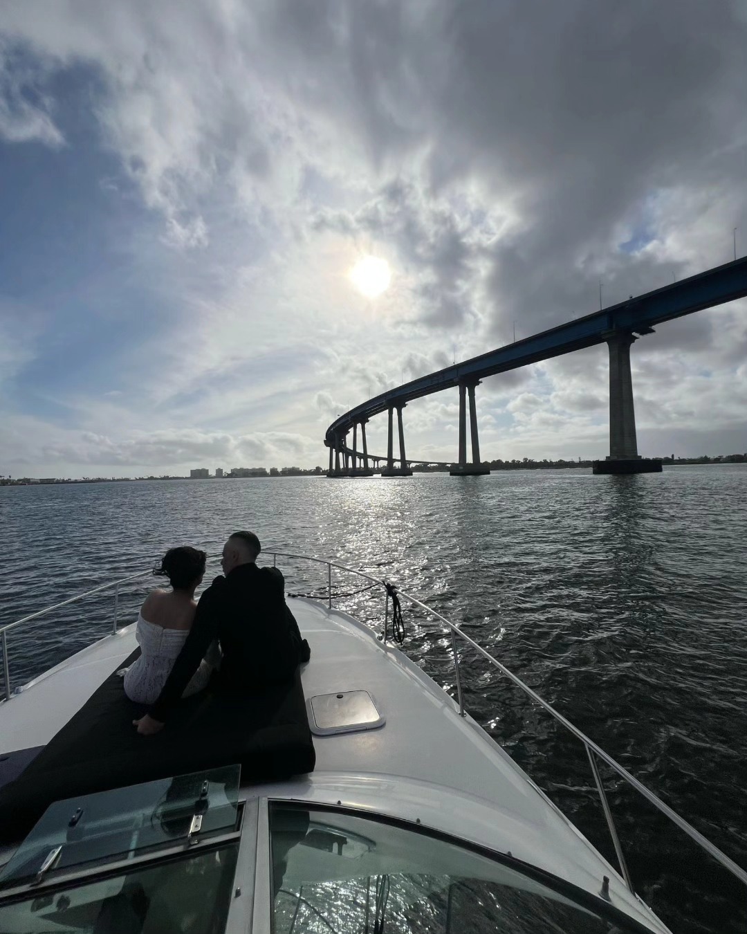 Couple enjoying wedding yacht charters San Diego on a private yacht with scenic views of the Coronado Bridge and San Diego Bay.
